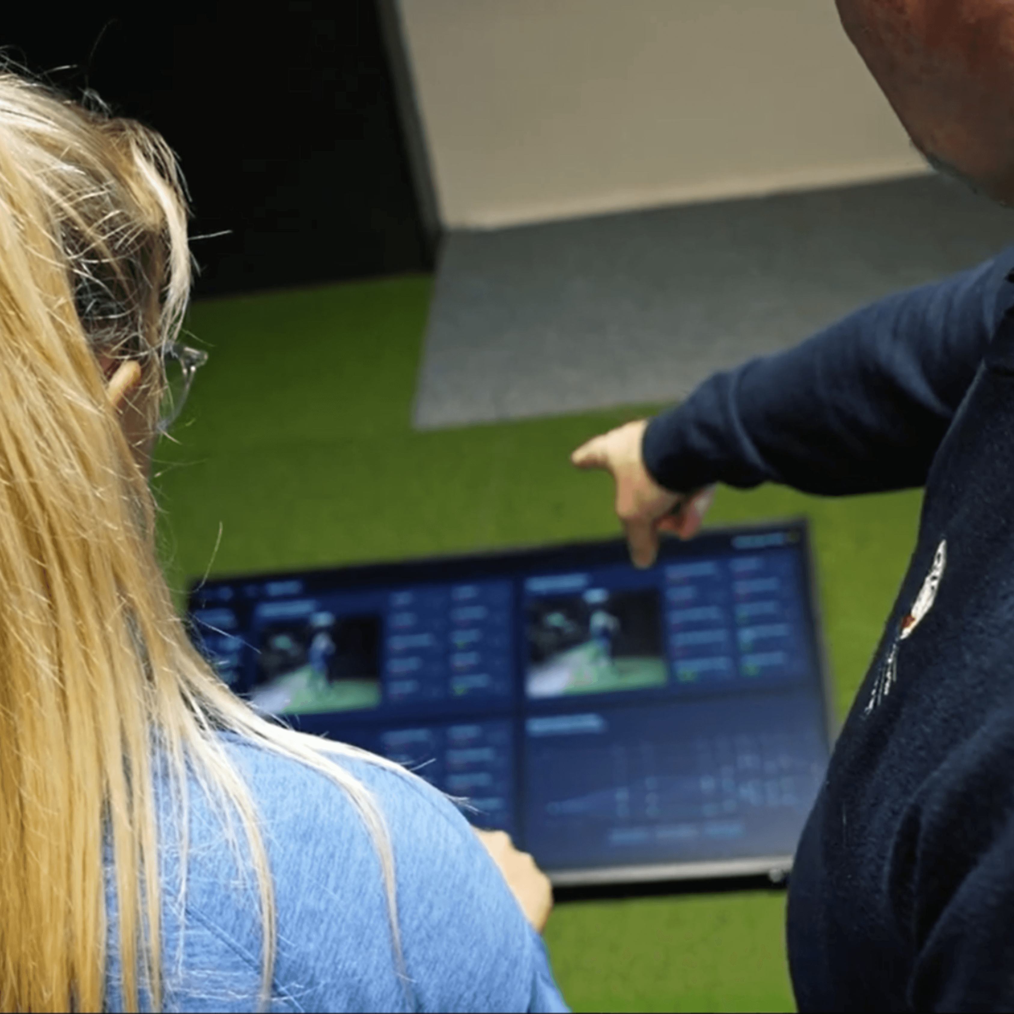 Coach reviewing swing data with player